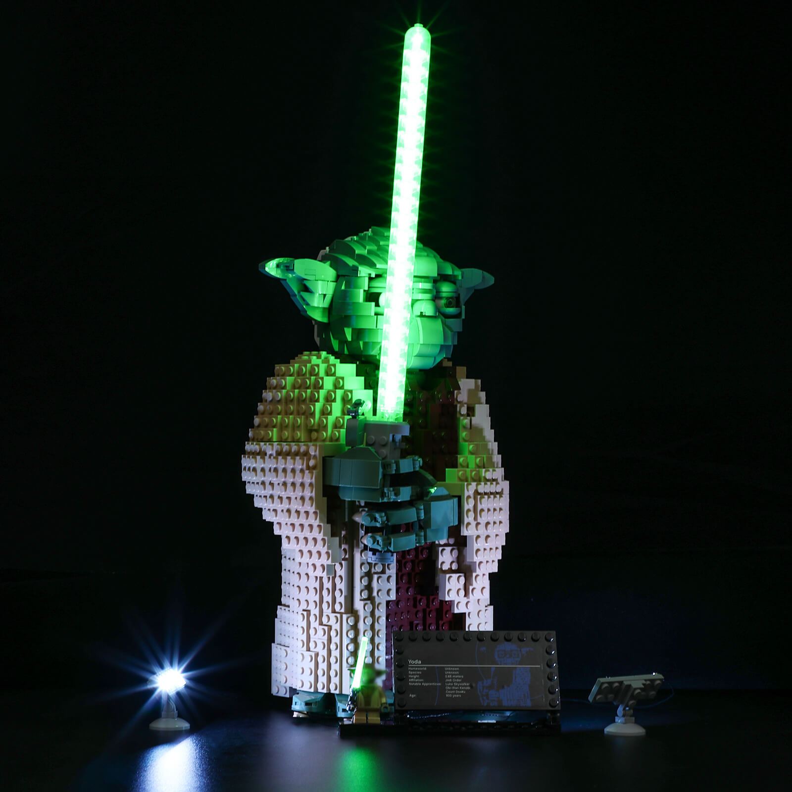 Jedi Master Yoda with lighting green lightsaber
