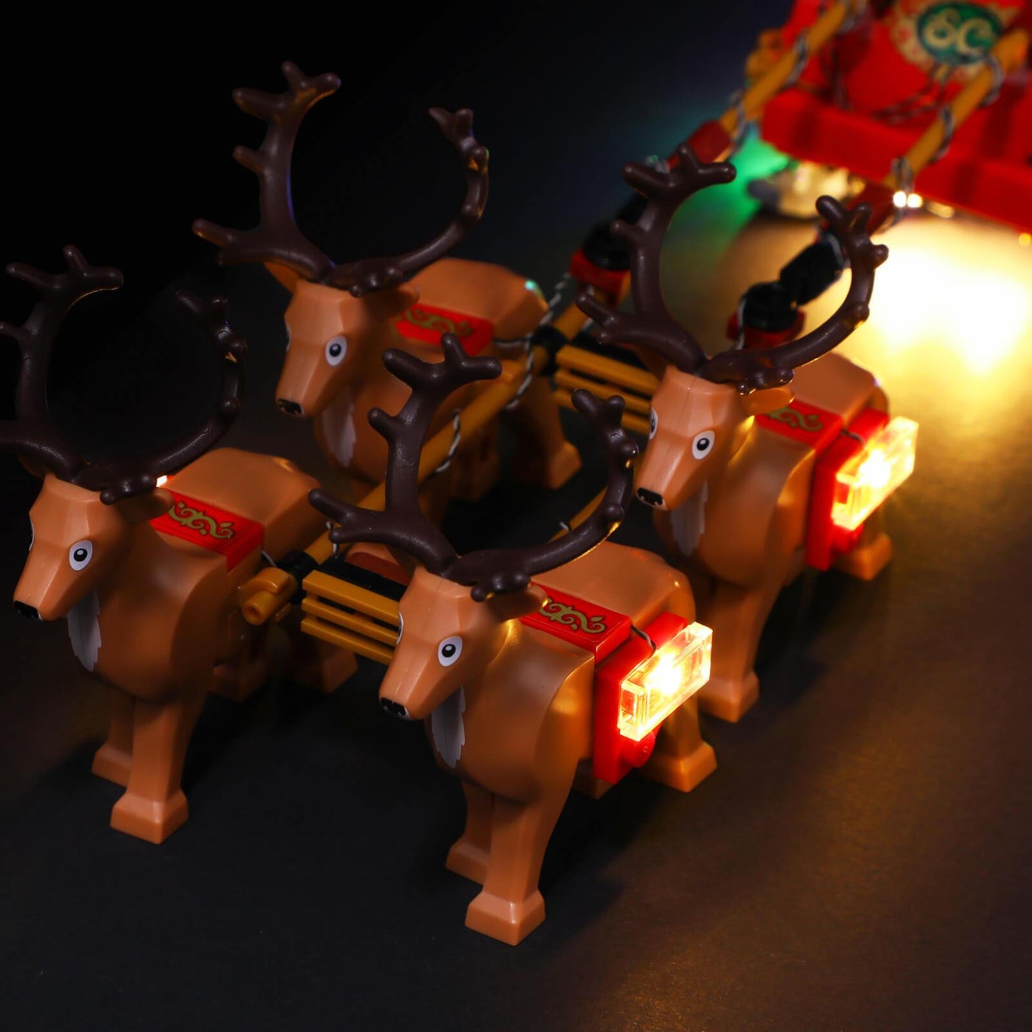  4 reindeer figures with warm light saddles